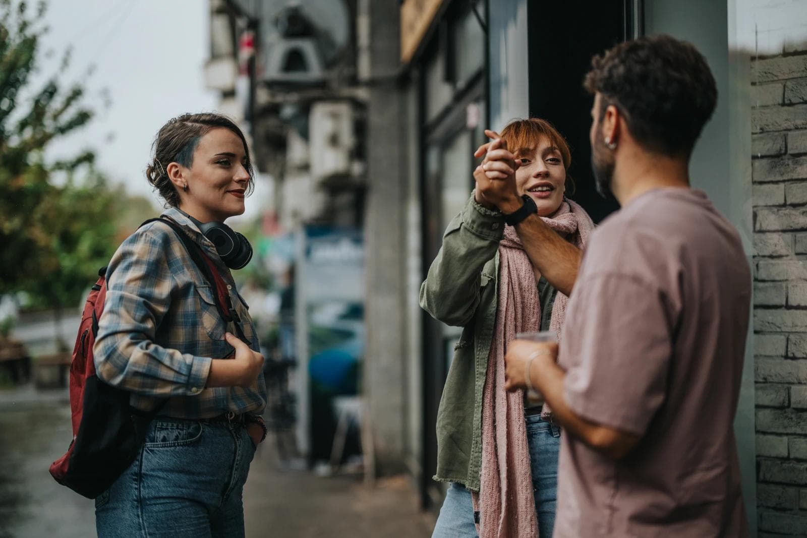 People talking on sidewalk in a chance encounter enjoing the conversation
